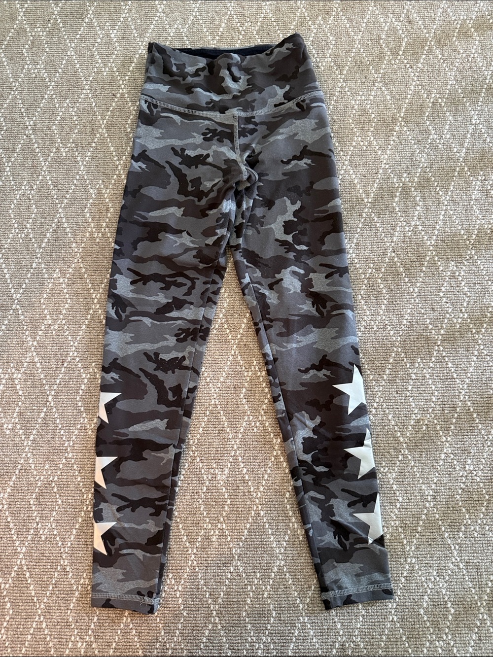 Strut this Gray Camo Leggings with White Star Accents. One size